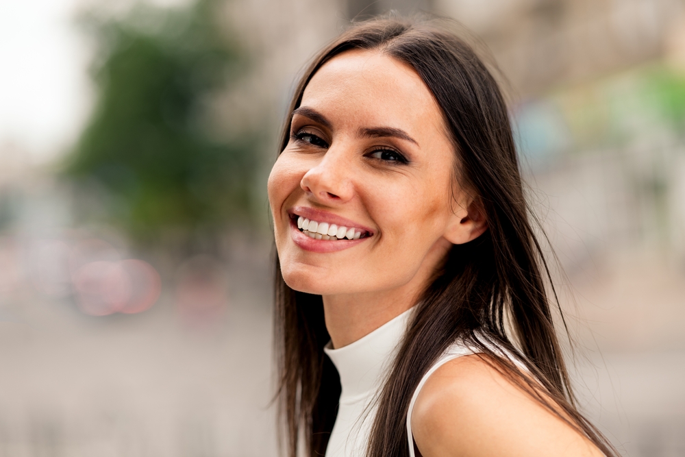 Woman smiling while outdoors